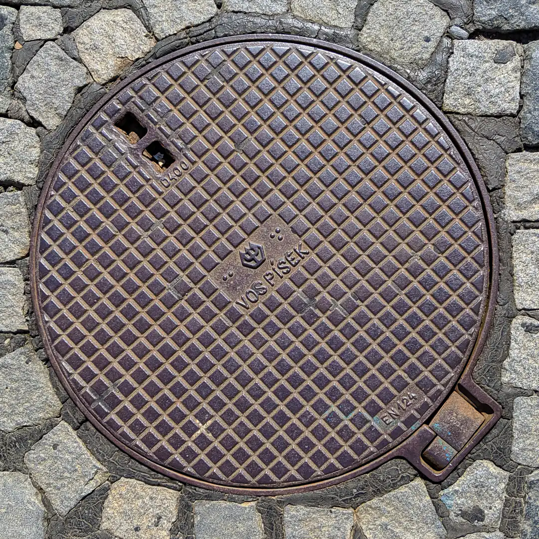 Manhole Cover by VOS a.s. Písek in Prague, Czech Republic. Photo by Yuri Matrosovich