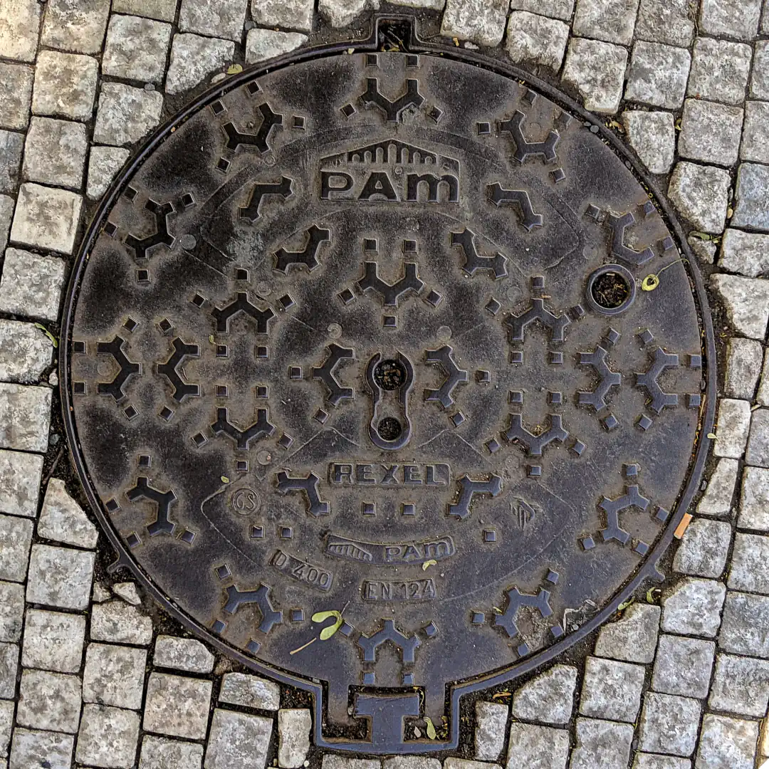 Manhole Cover by Pam in Prague, Czech Republic. Photo by Yuri Matrosovich