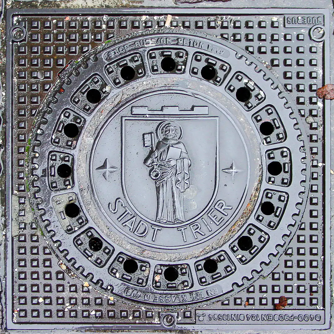 Manhole Cover with Trier Coat of Arms in Trier, Germany. Photo by Yuri Matrosovich