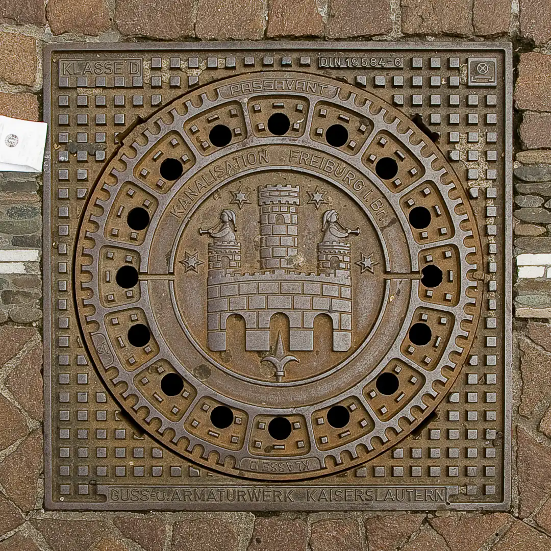 Freiburg Coat of Arms Manhole Cover in Freiburg, Germany. Photo by Yuri Matrosovich