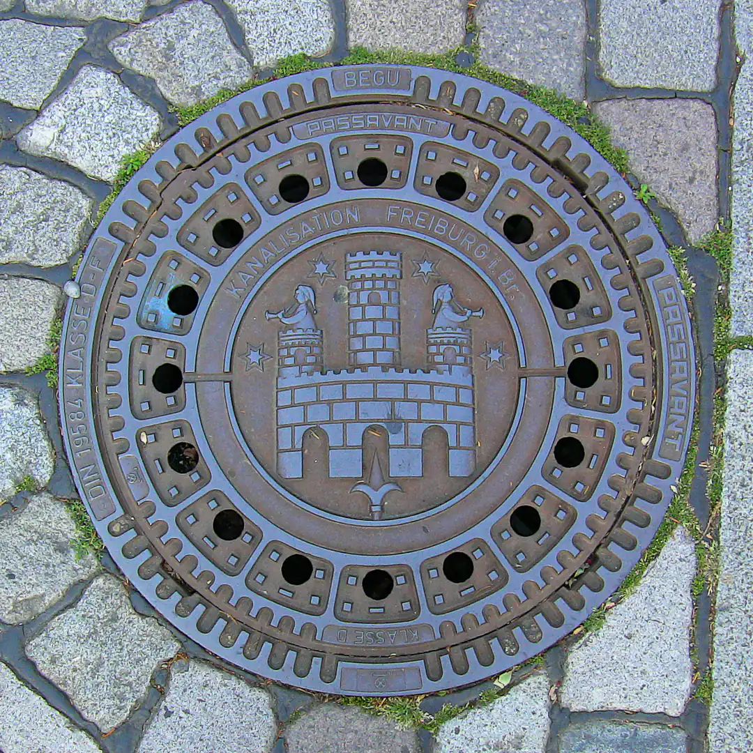 Freiburg Coat of Arms Manhole Cover in Freiburg, Germany. Photo by Yuri Matrosovich