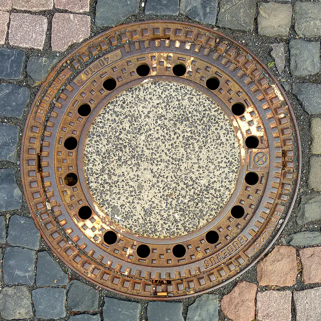 Manhole Cover by Buderus in Fritzlar, Germany. Photo by Yuri Matrosovich