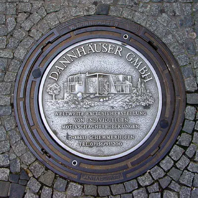 Dannhäuser GmbH Ad on Manhole Cover