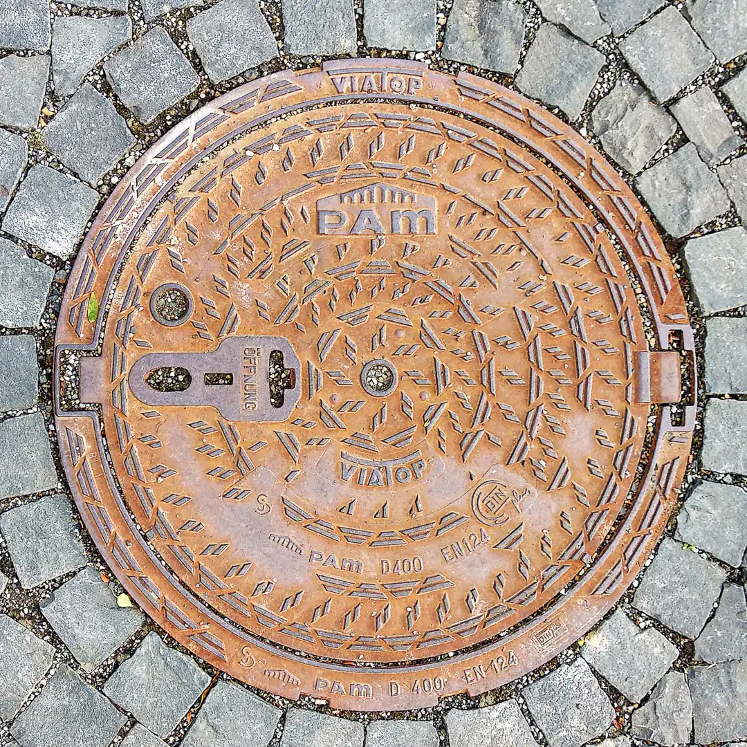 Manhole Cover by Pam in Kassel, Germany. Photo by Yuri Matrosovich