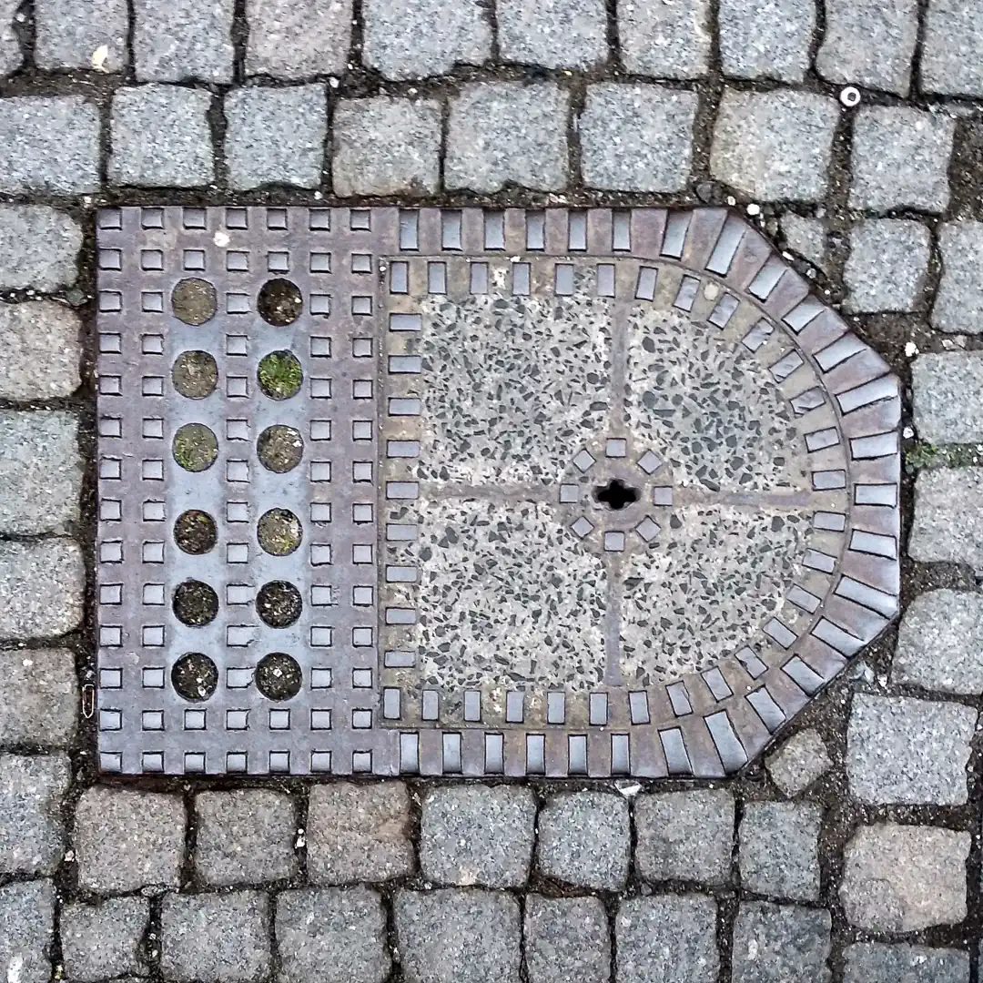 Manhole Cover in Marburg, Germany. Photo by Yuri Matrosovich