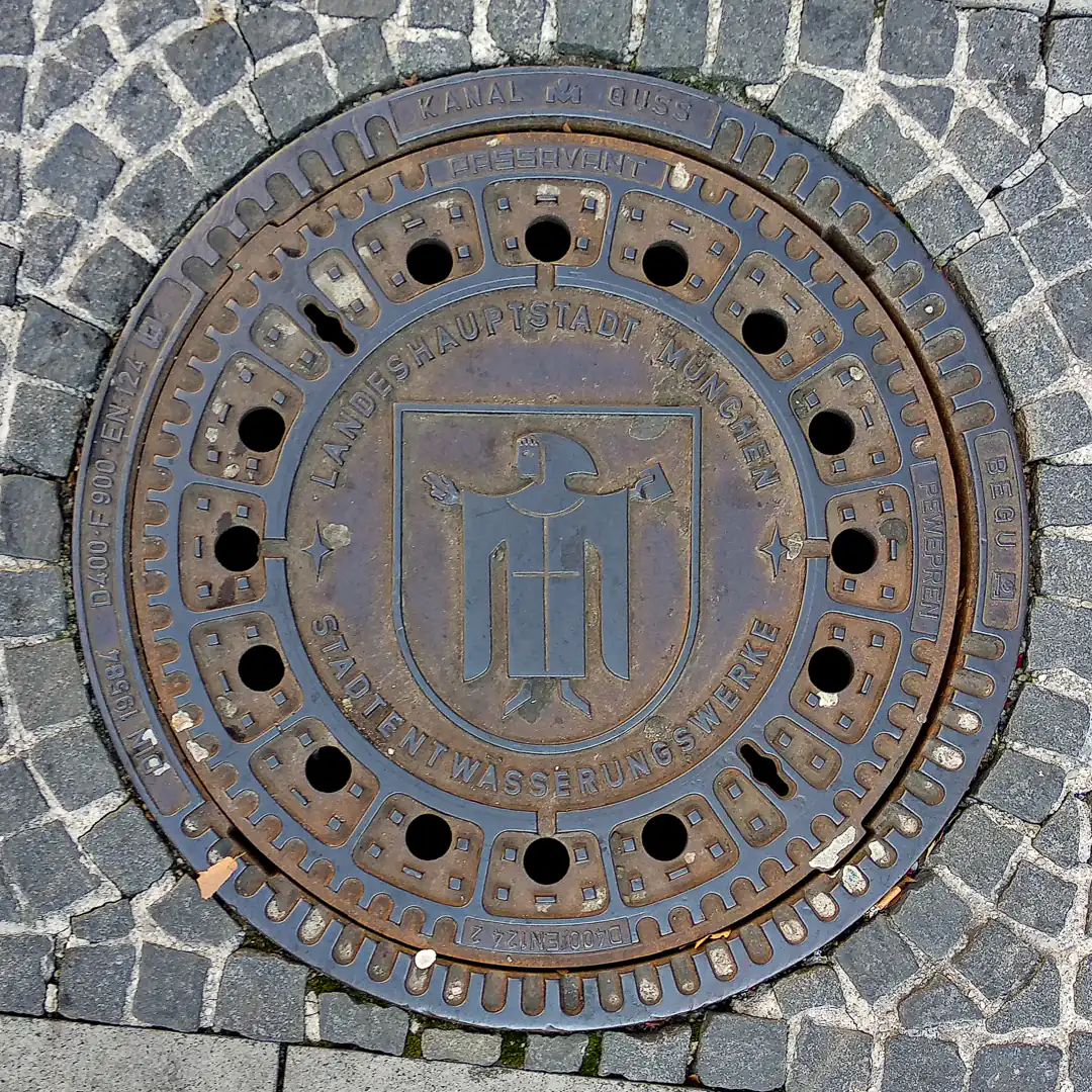 Munich Coat of Arms Manhole Cover in Munich, Germany. Photo by Yuri Matrosovich