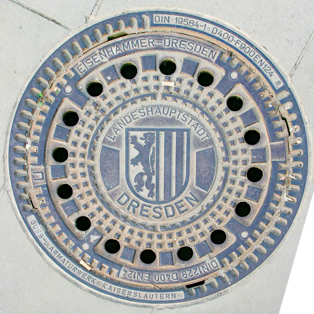 Manhole Cover with Dresden Coat of Arms in Dresden, Germany. Photo by Yuri Matrosovich