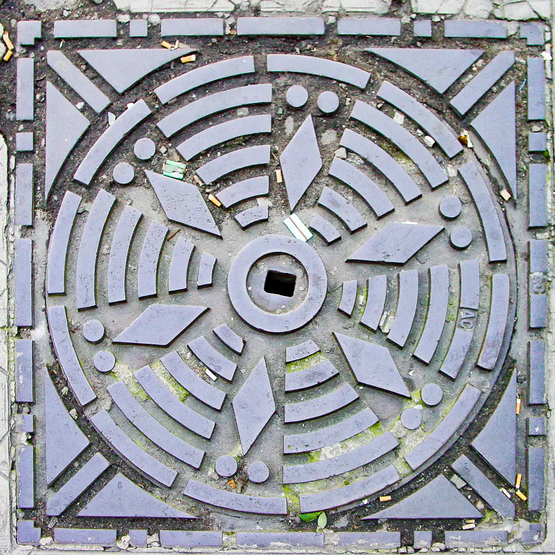 Manhole Cover in Paris, France. Photo by Yuri Matrosovich