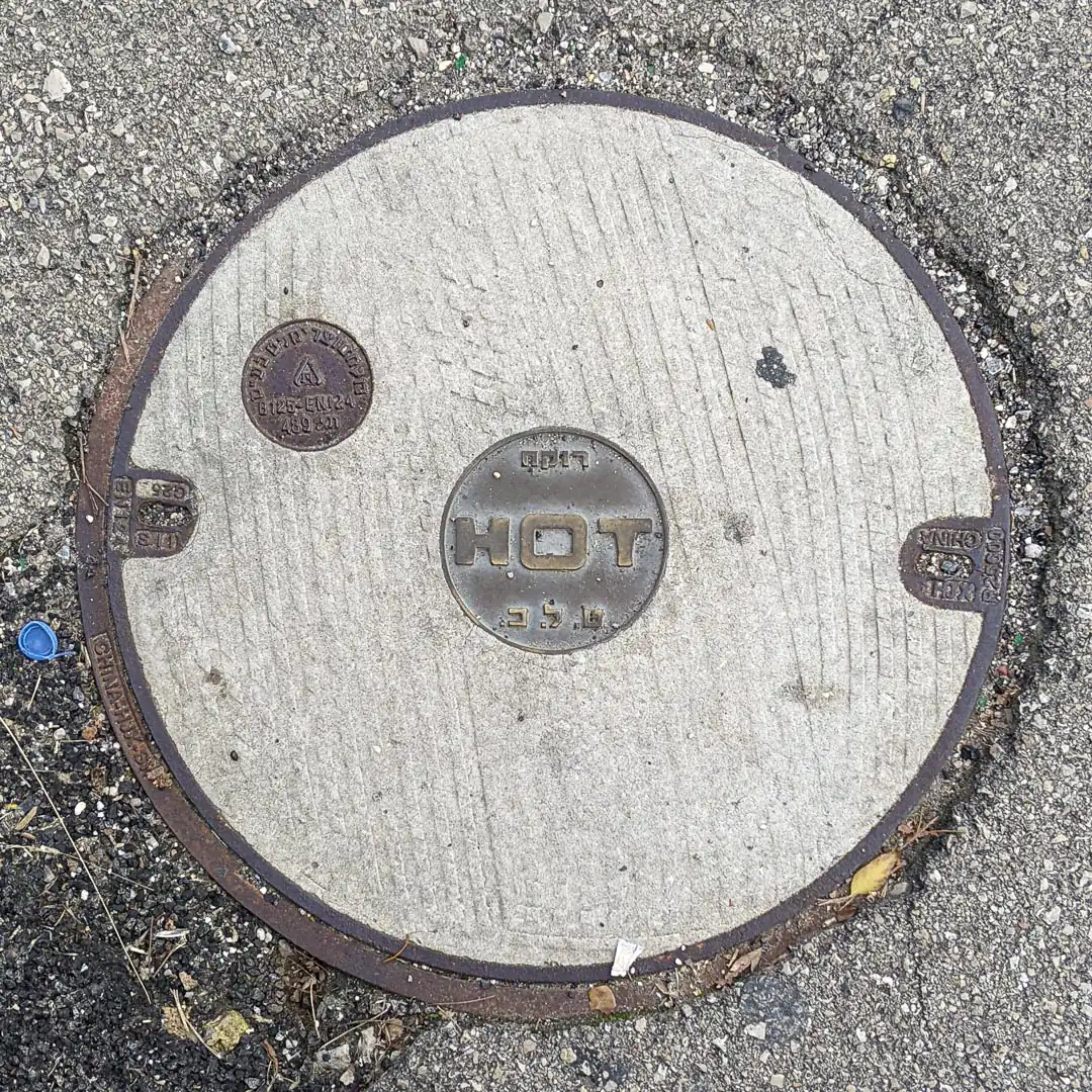 Cable Manhole Cover in Haifa, Israel. Photo by Yuri Matrosovich