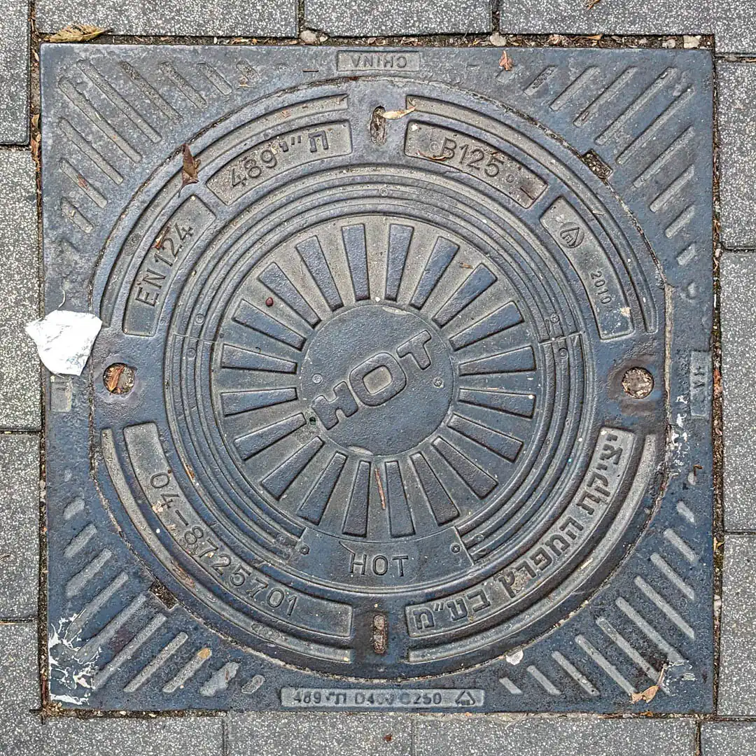 Cable Manhole Cover in Haifa, Israel. Photo by Yuri Matrosovich