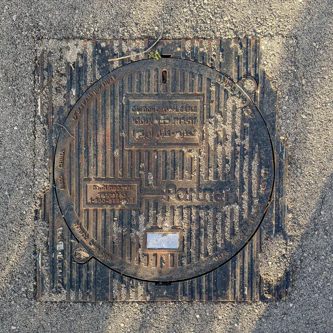 Cable Manhole Cover in Haifa, Israel. Photo by Yuri Matrosovich