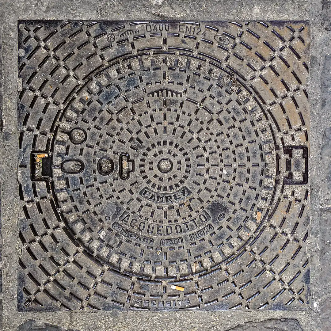 Water Manhole Cover by Pam in Florence, Italy. Photo by Yuri Matrosovich