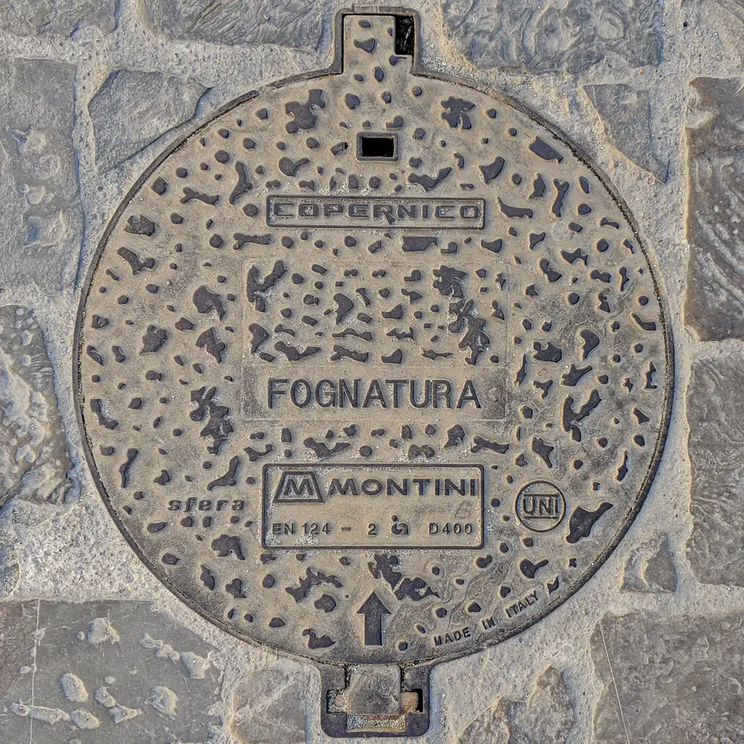 Sewerage Manhole Cover by Montini in Florence, Italy. Photo by Yuri Matrosovich