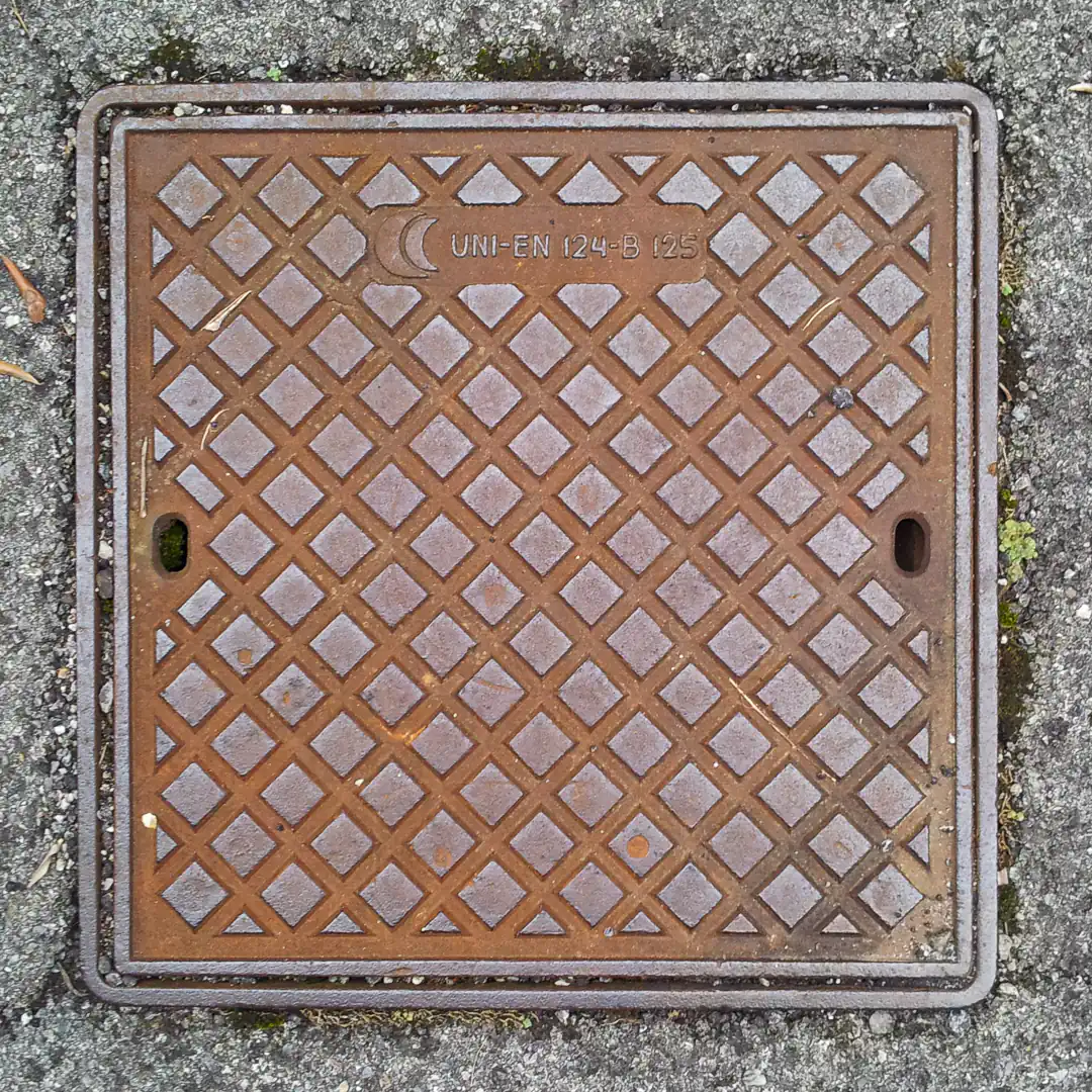 Manhole Cover in Bellagio, Italy. Photo by Yuri Matrosovich
