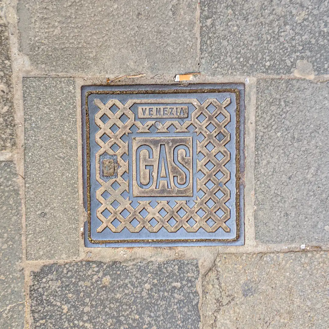 Venezia Gas Manhole Cover in Venice, Italy. Photo by Yuri Matrosovich
