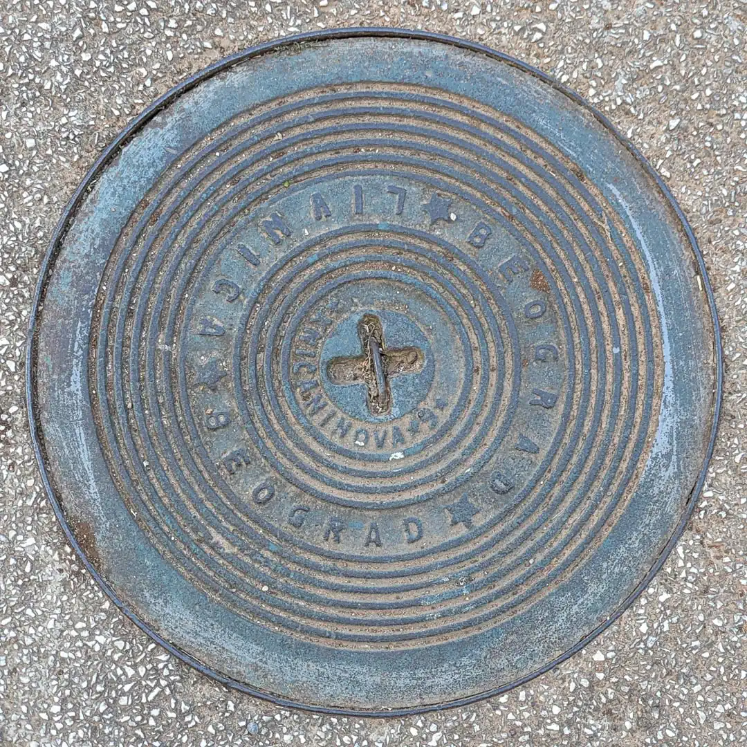 Manhole Cover in Budva, Montenegro. Photo by Denis Panin