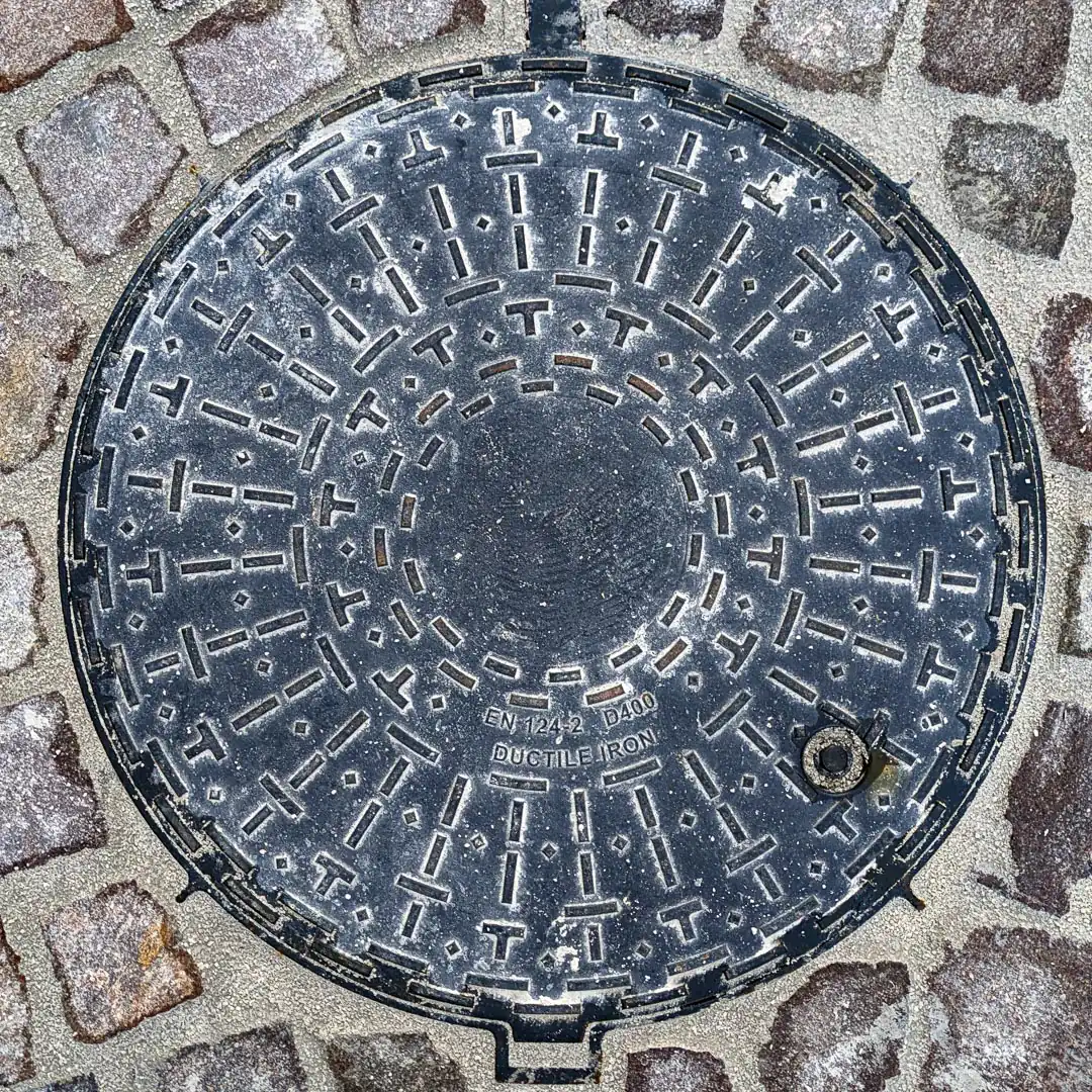 Manhole Cover in Budva, Montenegro. Photo by Denis Panin