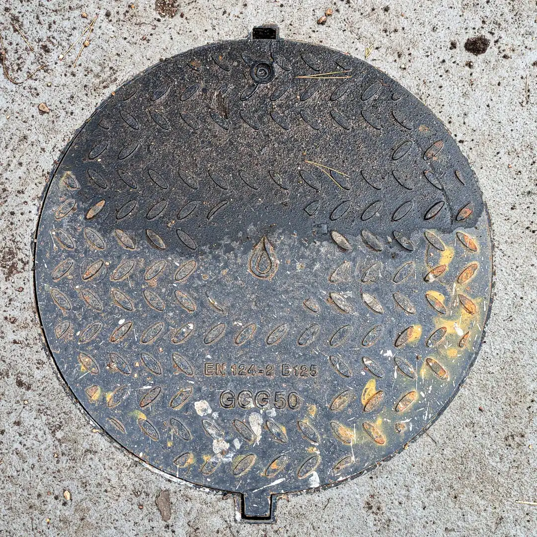 Manhole Cover in Budva, Montenegro. Photo by Denis Panin
