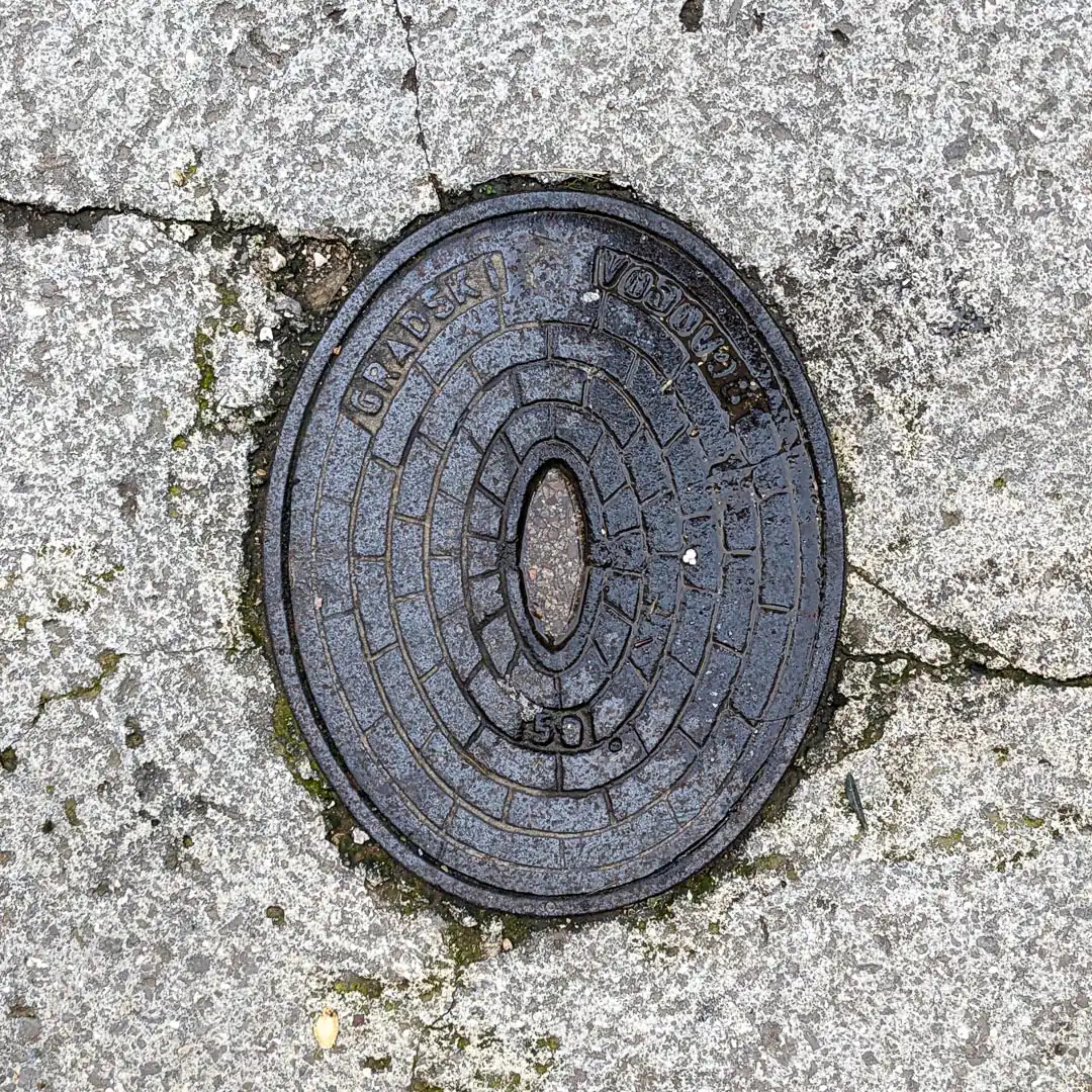 Water Manhole Cover in Budva, Montenegro. Photo by Denis Panin