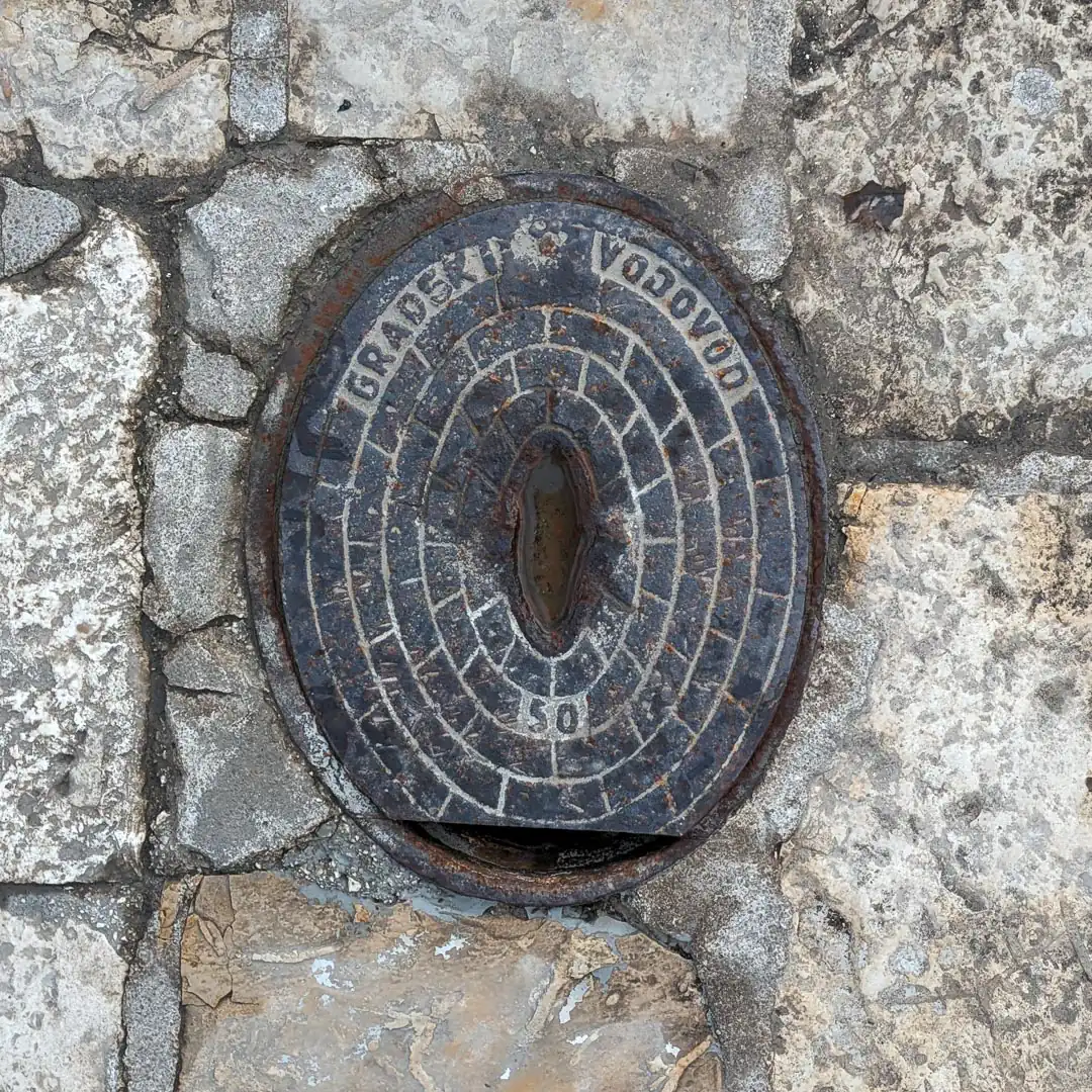 Water Manhole Cover in Budva, Montenegro. Photo by Denis Panin