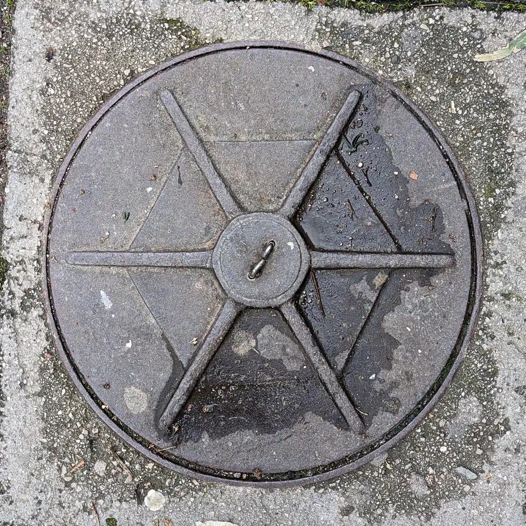 Manhole Cover in Budva, Montenegro. Photo by Denis Panin