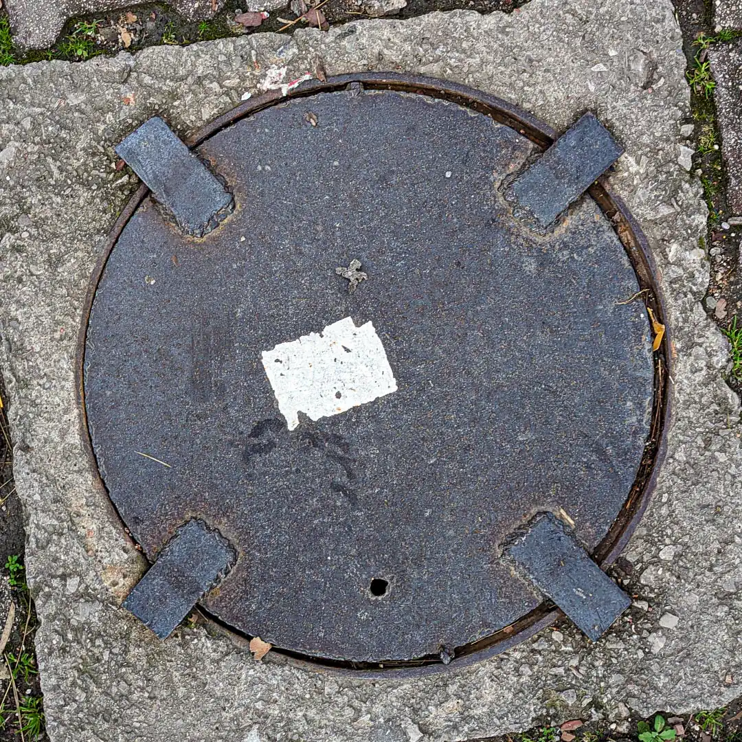 Manhole Cover in Budva, Montenegro. Photo by Denis Panin