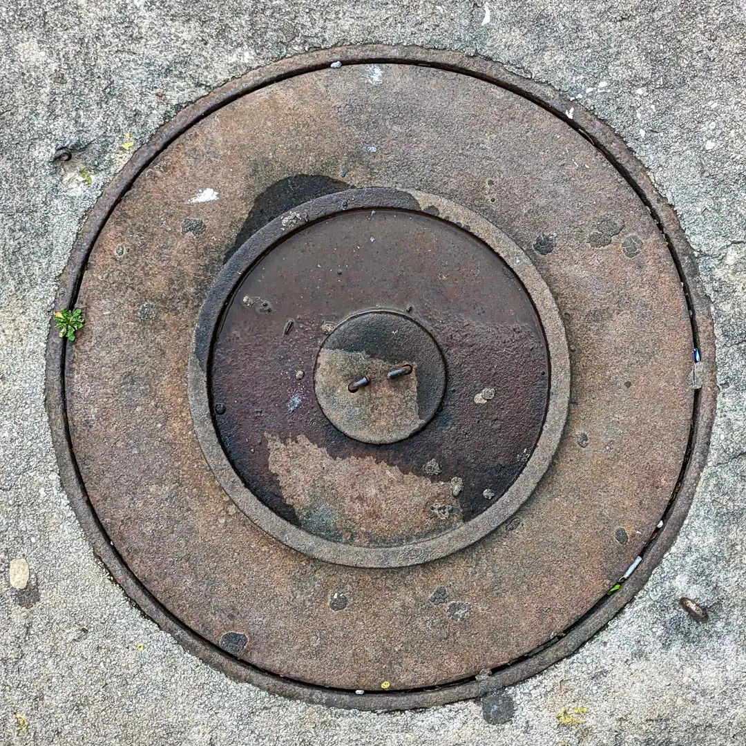 Manhole Cover in Budva, Montenegro. Photo by Denis Panin