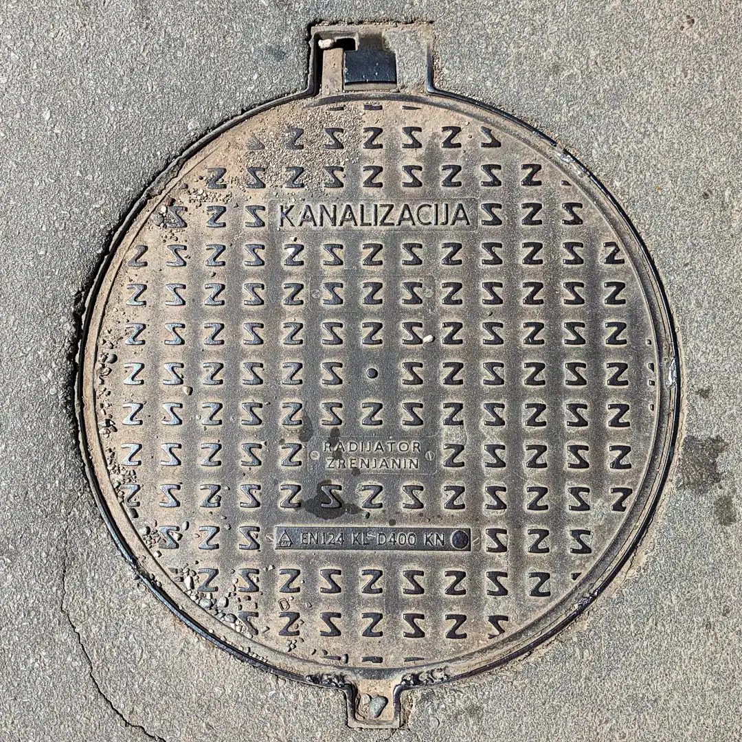Sewerage Manhole Cover by Radujator Zrenajin in Budva, Montenegro. Photo by Denis Panin
