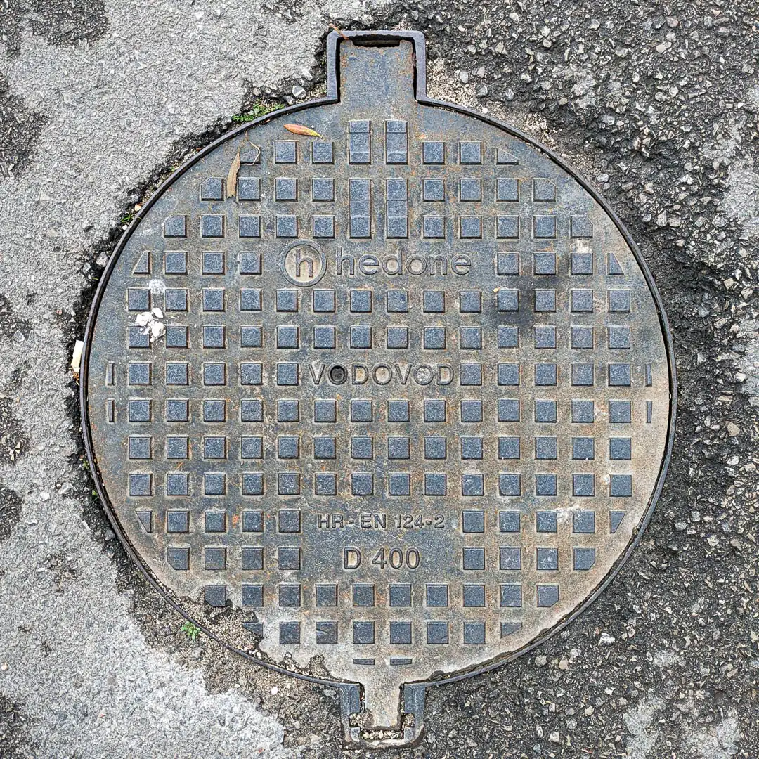Water Manhole Cover by Hedone in Budva, Montenegro. Photo by Denis Panin