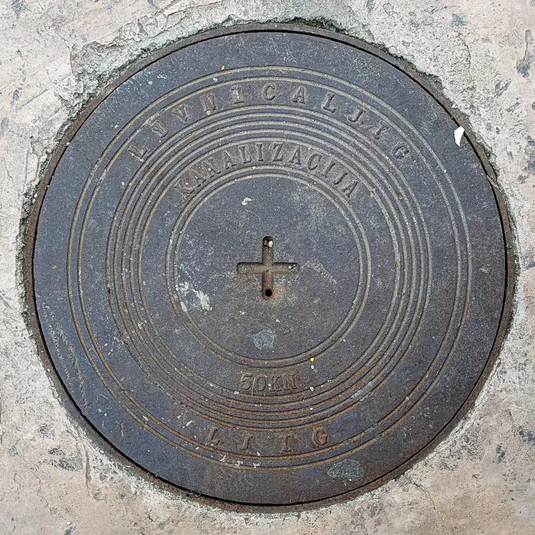 Sewerage Manhole Cover by Livnica Ljig in Budva, Montenegro. Photo by Denis Panin