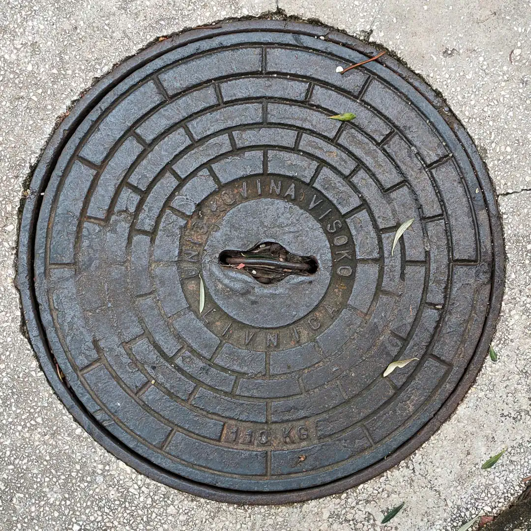 Manhole Cover by Unis Kovina in Budva, Montenegro. Photo by Denis Panin