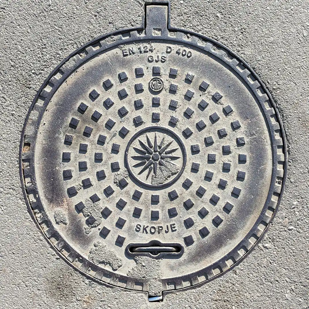 Manhole Cover in Budva, Montenegro. Photo by Denis Panin