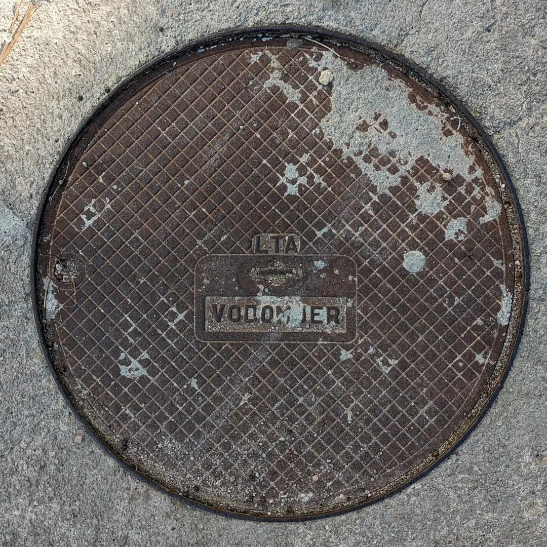 Water Manhole Cover in Budva, Montenegro. Photo by Denis Panin