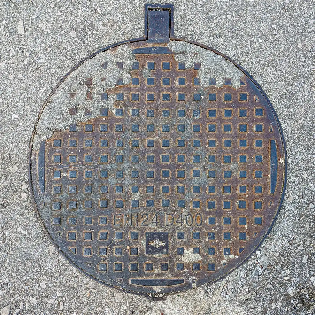 Manhole Cover in Budva, Montenegro. Photo by Denis Panin