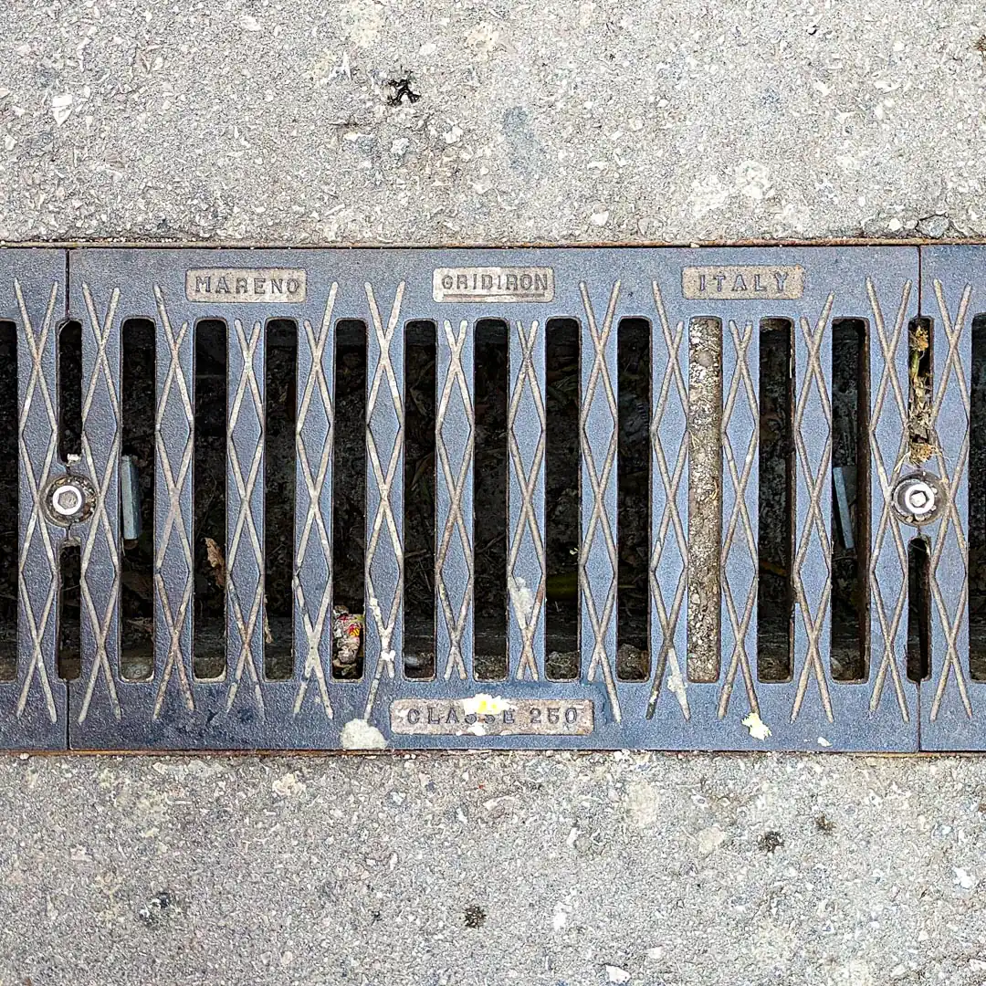 Drainage Manhole Cover by Gridiron in Budva, Montenegro. Photo by Denis Panin