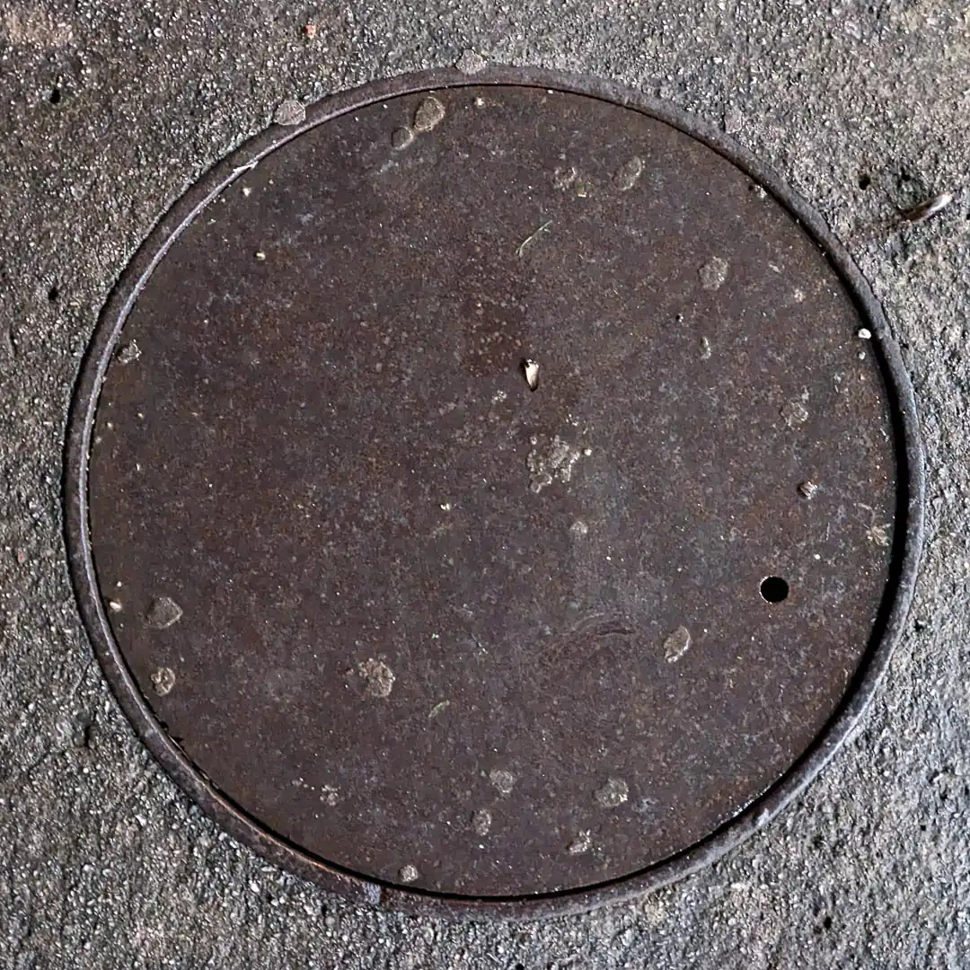 Manhole Cover in Budva, Montenegro. Photo by Denis Panin
