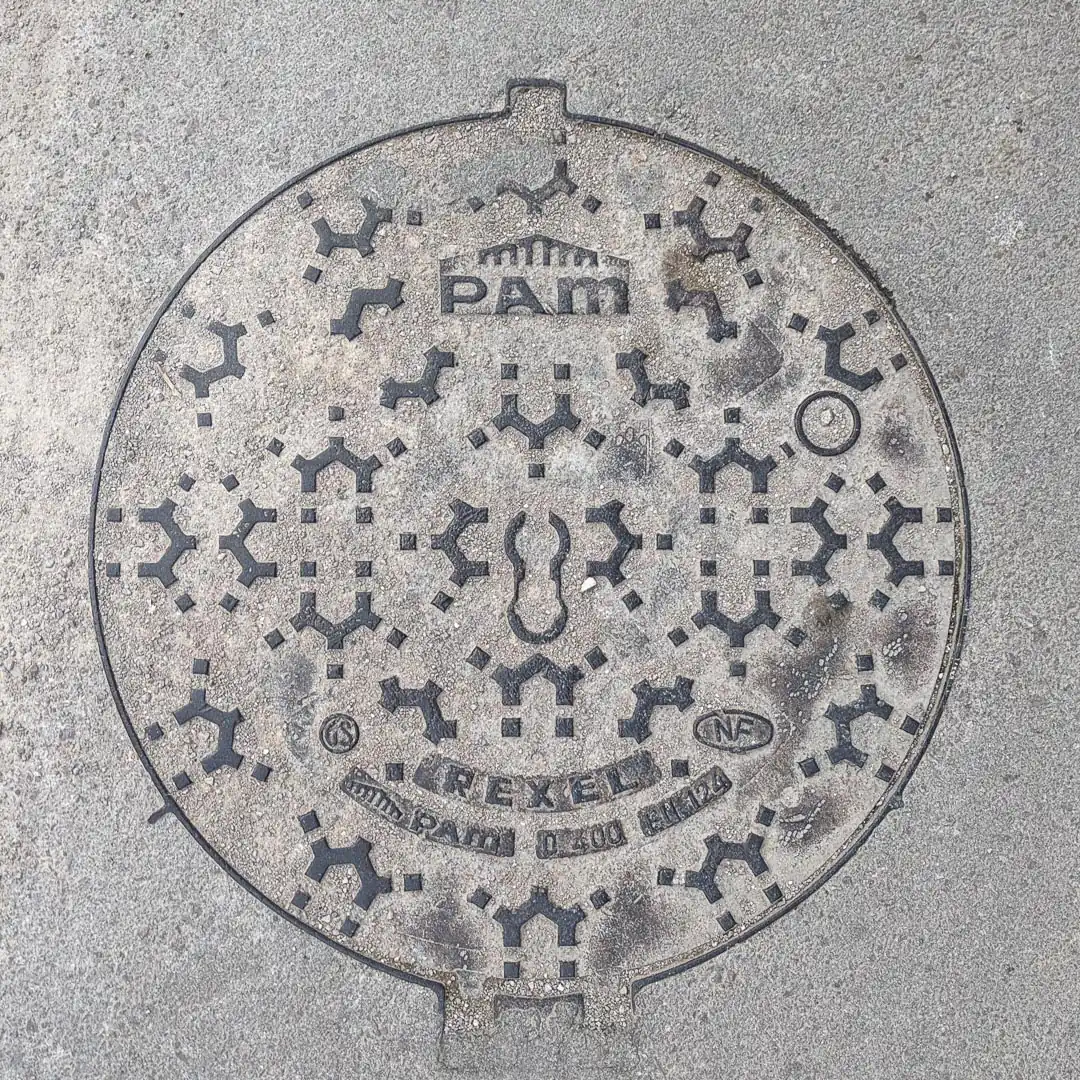 Manhole Cover by Pam in Budva, Montenegro. Photo by Denis Panin