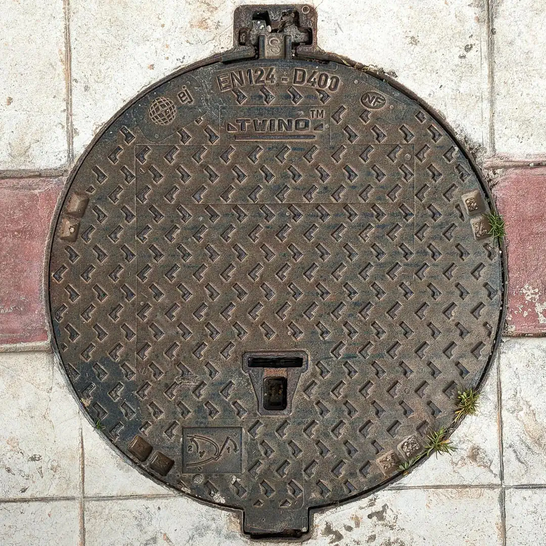 Manhole Cover by EJ Group in Bar, Montenegro. Photo by Denis Panin