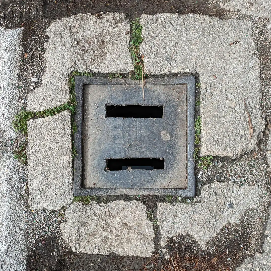 Drainage Manhole Cover in Bar, Montenegro. Photo by Denis Panin