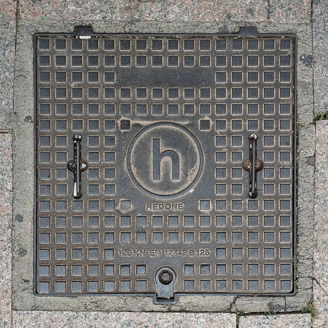 Manhole Cover by Hedone in Budva, Montenegro. Photo by Denis Panin