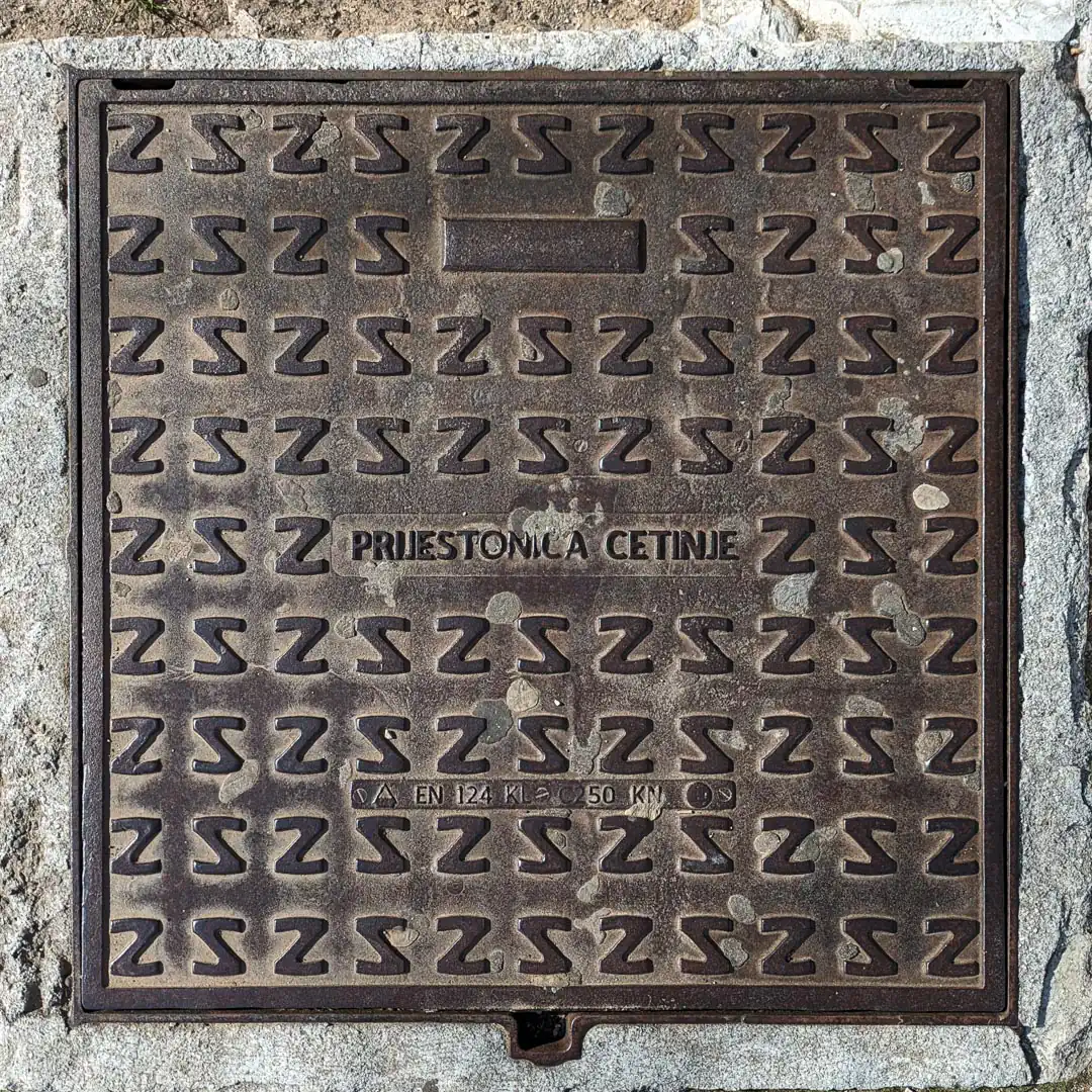 Manhole Cover in Cetinje, Montenegro. Photo by Denis Panin