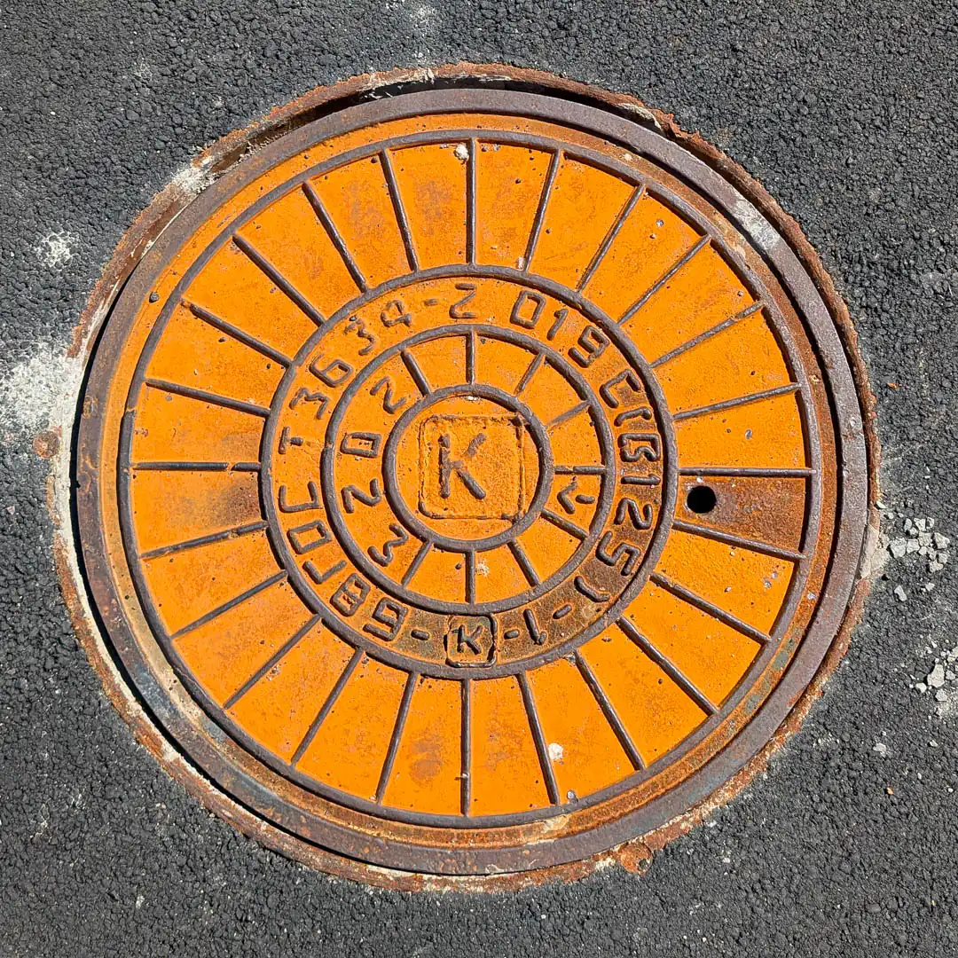 Sewerage Manhole Cover in Saint Petersburg, Russia. Photo by Yuri Matrosovich