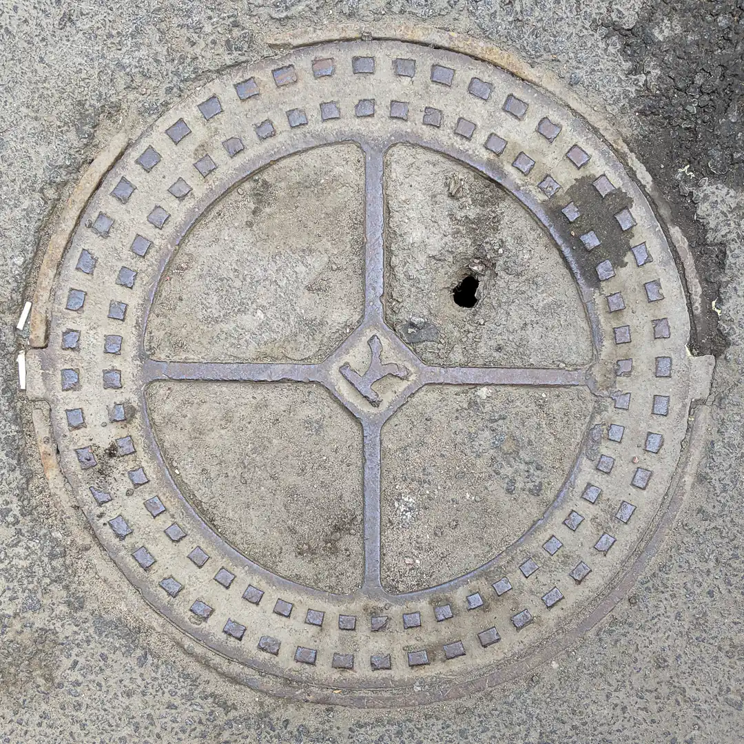 Sewerage Manhole Cover in Saint Petersburg, Russia. Photo by Yuri Matrosovich